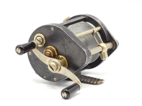 A very rare Hardy Silex Rex bait casting reel, twin reverse tapered ebonite handles on shaped cross bar nickel silver winding arm, ribbed brass foot, level line mechanism, milled nickel silver spindle caps, rear optional nickel silver check lever, rim 