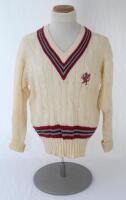 Ian Botham. Somerset Ist XI long sleeve sweater issued to and worn by Botham in his playing career. The cream woollen sweater by ‘Morrant Sports’ with county colours of maroon, grey and black to neck and waist and emblem of maroon dragon and red tongue. V