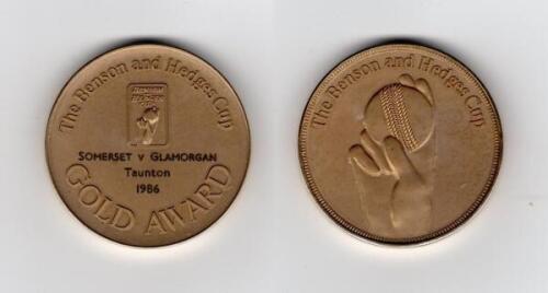 Ian Botham. Benson & Hedges Cup 1986. Original gold metal ‘Gold Award’ (Man of the Match) medal awarded to Botham playing for Somerset in their victory over Glamorgan in the Group C match played at Taunton, 13th May 1986. 2” diameter. In official presenta