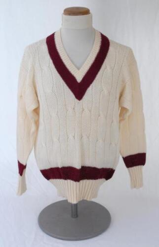 Ian Botham. Queensland Ist XI long sleeve sweater issued to and worn by Botham in his playing career. The woollen sweater by ‘Kent & Curwen’ with county colours of maroon to neck, waist and cuffs. Very good condition.