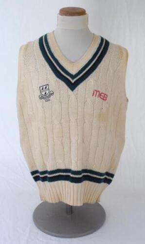 Ian Botham. Worcestershire 1st XI sleeveless sweater issued to and worn by Botham. The woollen sweater by ‘Duncan Fearnley’ with county colours of green, white and black to neck and waist, county ‘three black pears’ and ‘MEB’ sponsor’s emblems to chest. V