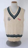 Ian Botham. Worcestershire 1st XI sleeveless sweater issued to and worn by Botham. The woollen sweater by ‘Duncan Fearnley’ with county colours of green, white and black to neck and waist, county ‘three black pears’ and ‘MEB’ sponsor’s emblems to chest. B