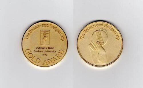 Ian Botham. Benson & Hedges Cup 1992. Original gold metal ‘Gold Award’ (Man of the Match) medal awarded to Botham playing for Durham against Glamorgan, in the Group D match at Durham, 21st April 1992. 2” diameter. In official presentation case.