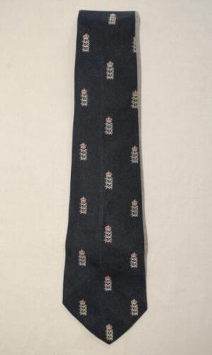 Ian Botham. England ‘Home’ Test tie. Official navy blue silk tie with England three lions and crown repeating emblems, issued to and worn by Botham during his playing career. Series unknown. Very good condition.