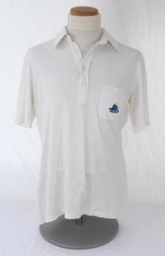 Ian Botham. England 1980s. Original England Test short sleeve shirt worn by Botham during the 1980s. The shirt by Lyle & Scott with England lion and stumps emblem to breast pocket. Very good condition.