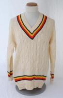 Ian Botham. England 1980s. Original M.C.C. touring long sleeve woollen sweater worn by Botham during his playing career. The sweater with M.C.C. colours to neck, waist and cuffs. Bill Edwards of Swansea. Very good condition.