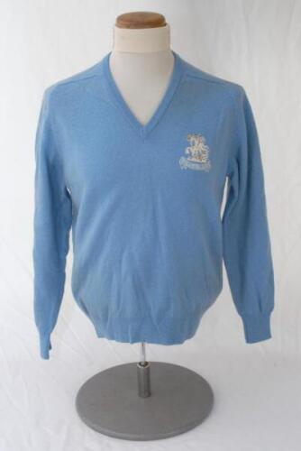 Ian Botham. Pale blue casual woollen long sleeve sweater issued to Botham for the M.C.C./ England tour to Australia 1978/79. The sweater, by ‘Lyle & Scott’ with tour emblem of St. George and Dragon with scroll below, ‘1978 Australia 1979’ to chest. Very g