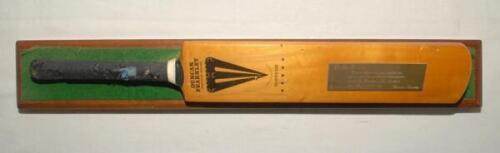 Ian Botham. A miniature Duncan Fearnley ‘Supreme’ cricket bat, laying on green felt and mounted to long wooden plinth with gold metal plaque to blade inscribed ‘To Ian Botham, Congratulations on your maiden Test Century and other wonderful achievements du