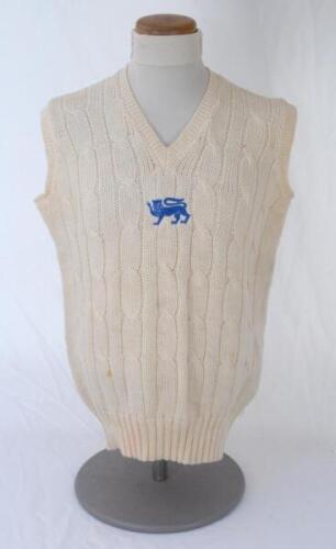 Ian Botham. England 1980s. Original England one day international woollen sleeveless sweater worn by Botham during his playing career. The sweater by Simpson of Piccadilly with single blue lion emblem to chest. Small stain to front, otherwise in very good