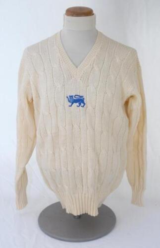 Ian Botham. England 1980s. Original England one day international woollen long sleeve sweater worn by Botham during his playing career. The sweater by Simpson of Piccadilly with single blue lion emblem to chest. Very good condition.