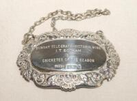 Ian Botham. A silver decanter/wine label with hanging chain presented to Botham as ‘The Sunday Telegraph, Victoria Wine. ‘Cricketer of the Year 1981’. Details engraved to label. Hallmarked London 1982. Very good condition.