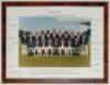 ‘England Tour Australia and New Zealand 1982- 1983’. Official colour photograph of the England touring party seated and standing in rows wearing tour blazers. The photograph measures 10”x7”, laid to official photographer’s mount with printed title to top 