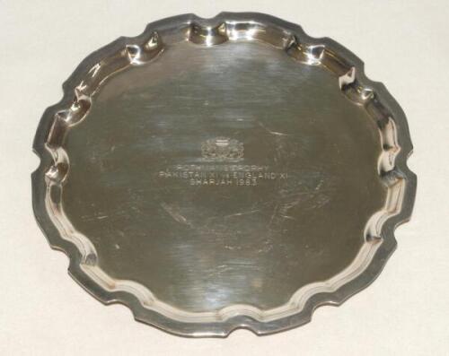 Ian Botham. A small silver metal salver/plate presented to Botham following his appearance for an England XI v Pakistan XI in an unofficial charity match played in Sharjah in March 1983. The circular salver with the engraved inscription to centre ‘Rothman