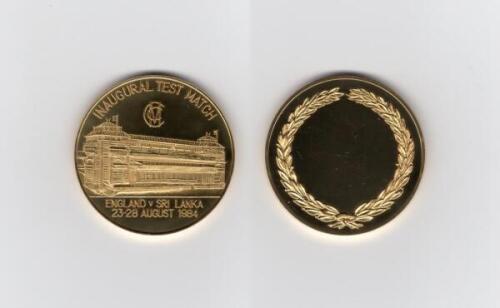 Ian Botham. Inaugural Test, England v Sri Lanka 1984. Commemorative gold plated medal presented to Botham on the occasion of the England and Sri Lanka Test played at Lord’s on the 23rd- 28th August 1984. The medal with the Lord’s pavilion to face, M.C.C. 