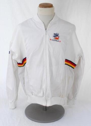Ian Botham. The Ashes. England tour to Australia 1986/87. Original white England tracksuit top with St. George and the Dragon emblem to chest, &lsquo;86 Australia 87&rsquo; below, and stripes in M.C.C. colours to sides. The top by Nike. Worn by Botham during the tour