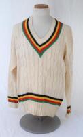 Ian Botham. Tim Hudson’s XI (Hudson’s Hollywood XI) long sleeve woollen sweater by ‘Hudson’s Hardware’ with team rainbow colours of black, yellow, red and green to neck, waist and cuffs. ‘Botham’ embroidered to label. Very good condition.