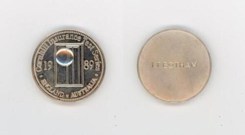 Ian Botham. England v Australia Test Series 1989. A silver metal medal presented to Botham whilst playing for England in the 1989 Test series against Australia. The medal with relief of ball and stumps and wording, &lsquo;Cornhill Insurance Test Series. England