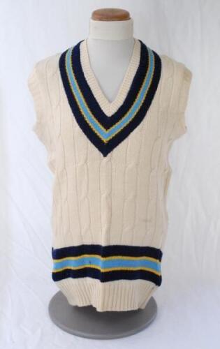 Kapil Dev. Haryana & India 1975-1994. Original India woollen sleeveless sweater worn by Kapil Dev during his playing career, probably 1980s. The sweater with India colours of dark blue, yellow and pale blue to neck and waist. Made by Mohla Traders, India.