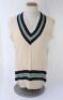 Kapil Dev. Haryana & India 1975-1994. Original India woollen sleeveless sweater worn by Kapil Dev during his playing career, probably 1980s. The sweater with India colours of dark blue, yellow and pale blue to neck and waist. Made by Mohla Traders, India.