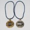 Ian Botham. &lsquo;Benson & Hedges World Cup 1992&rsquo;. Two original gold metal medals presented to Botham for the launch of the 1992 World Cup held in Australia and New Zealand. The medals with colour World Cup emblem to centre. Engraving to verso, &lsquo;Australia, New