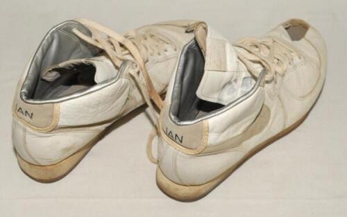 Ian Botham. A pair of Nike cricket boots with full leather upper and metal studs to sole, worn by Ian Botham in the late 1980&rsquo;s, the boots with distinctive Nike &lsquo;Swoosh&rsquo; tick. The boots were personalised for Botham by Nike and &lsquo;IAN&rsquo; is printed to the hee