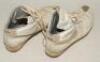 Ian Botham. A pair of Nike cricket boots with full leather upper and metal studs to sole, worn by Ian Botham in the late 1980&rsquo;s, the boots with distinctive Nike &lsquo;Swoosh&rsquo; tick. The boots were personalised for Botham by Nike and &lsquo;IAN&rsquo; is printed to the hee