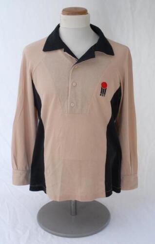 Lance Cairns. New Zealand. Benson & Hedges World Series Cup 1982/83. Original New Zealand long sleeve shirt and trousers. The shirt in beige with black collar and side panels, with &lsquo;W.S.C.&rsquo; emblem to chest, the matching beige trousers with black lining to