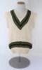 Allan Border. New South Wales & Australia 1976-1996. Original Australia woollen sleeveless sweater worn by Border during his playing career, probably 1980s. The sweater with Australia colours of green and gold to neck and waist, no emblem to chest. Maker 