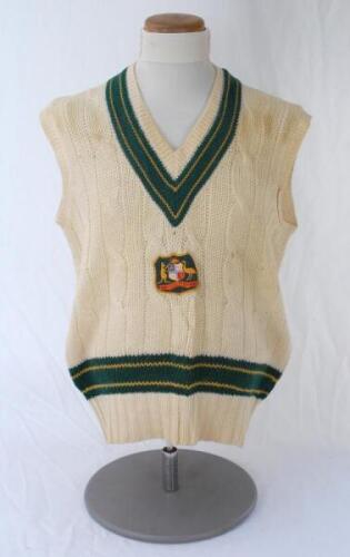 Rodney Hogg. South Australia & Australia 1975-1987. Original Australia woollen sleeveless sweater worn by Hogg during his playing career, probably early 1980s. The sweater with Australia colours of green and gold to neck and waist, Australia shield emblem