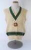 Rodney Hogg. South Australia & Australia 1975-1987. Original Australia woollen sleeveless sweater worn by Hogg during his playing career, probably early 1980s. The sweater with Australia colours of green and gold to neck and waist, Australia shield emblem