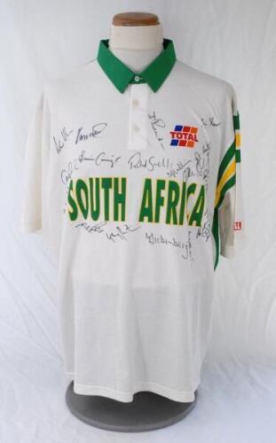 South Africa tour to England 1994. Short sleeve shirt by &lsquo;Tracstar&rsquo;,white to the front, green to the back, with green collar and green and yellow stripes to the left sleeve. &lsquo;McMillan&rsquo; to back. &lsquo;South Africa&rsquo; and &lsquo;Total&rsquo; sponsor&rsquo;s emblem to chest. Size &lsquo;X