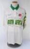 South Africa tour to England 1994. Short sleeve shirt by &lsquo;Tracstar&rsquo;,white to the front, green to the back, with green collar and green and yellow stripes to the left sleeve. &lsquo;McMillan&rsquo; to back. &lsquo;South Africa&rsquo; and &lsquo;Total&rsquo; sponsor&rsquo;s emblem to chest. Size &lsquo;X