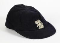 John Hugh Edrich. Surrey & England 1956-1978. England navy blue touring cap, by Simpson of Piccadilly, with England emblem to front of St George & the Dragon embroidered in white thread. The cap makers label inside with handwritten initials ‘J.E. in blue 