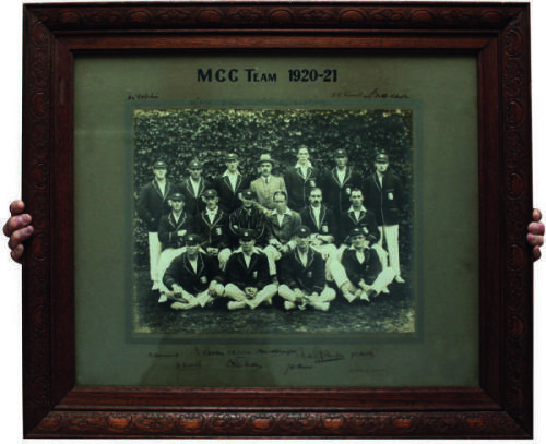 M.C.C. tour of Australia 1920/1921. Large and impressive official mono photograph of the M.C.C. team who toured Australia in 1920/21, seated and standing in rows and wearing cricket attire and tour caps and blazers with printed title to top border ‘M.C.C.