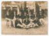 Australia tour of England 1909. Sepia real photograph plain back postcard of the Australian touring party seated and standing in rows wearing caps and tour blazers. Signed in ink to verso by all sixteen members of the touring party. Signatures are Noble (