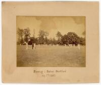 ‘Epping v Bishop Stortford’ 1863. Early original sepia photograph depicting a general view of the match in progress in a country setting with the bowler about to begin his run-up, batsmen at the wicket, fielders in position etc. The players seen in cricke