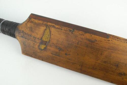 A ‘Pod’ cricket bat. An early 19th Century ‘pod’ cricket bat from around circa 1820. The bat is unspliced with narrow straight shoulders and flaring towards the toe. The face is unusually slight convex and the back of the blade is ridged and bowed. Part o