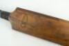 A ‘Pod’ cricket bat. An early 19th Century ‘pod’ cricket bat from around circa 1820. The bat is unspliced with narrow straight shoulders and flaring towards the toe. The face is unusually slight convex and the back of the blade is ridged and bowed. Part o