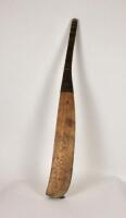 A mid eighteenth century circa 1740-1750 cricket bat of light wood, possibly willow, with right-handed curve and distinctive hook-shape to base, no shoulders, made by William Pett of Sevenoaks with two impressed marks ‘W. Pett 4’ on top of handle and ‘Wil