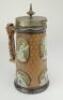 Cricketing jug. A large and impressive Doulton Lambeth stoneware tapering jug, moulded in relief with six raised figures, three of batsman, two of fielders and a wicket keeper in roundels, all different and in various positions. With two further smaller r - 3