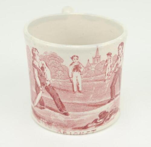 Cricket mug. Small ceramic mug with village cricket scene of boys playing cricket, in red, with trees and church to background with the title ‘Cricket’ below, circa 1900. Good condition.