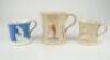 Cricket mugs. Three similer Staffordshire waisted mugs with strap handles and beaded rims. With three relief moulded figures of a batsman, bowler and wicket keeper, believed to be Lillywhite, Pilch and Box. Floral decoration between figures, c1880’s. The 