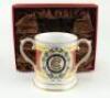 M.C.C. Bicentenary 1787-1987. Spode china two handled loving tankard with decoration and titles to front and back, gold lustre to handles, rim, and base. 4.5” tall. In presentation box as issued. Sold with a commemorative bronze metal medal in original pr