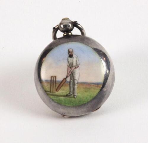 Cricket sovereign case. A Victorian silver sovereign case, decorated in enamel with a figures of a bearded batsman wearing a hooped cap, with bat raised in front of the wicket to one side. The case, with hallmarks for what appears to be London 1897, has t