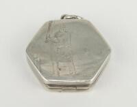 Cricket locket. Silver hexagon shaped opening locket with batsman at the wicket centre decoration, floral borders. Hallmarked Birmingham 1915. Minor signs of wear otherwise in good condition.