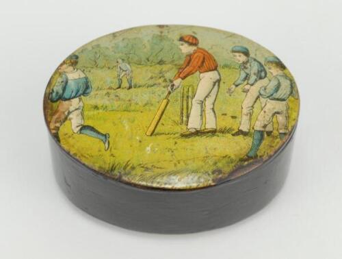 Cricket snuff box. A black lacquered papier mache oval snuff/pill box with hinged lid, believed to be circa 1870’s. The lid painted with a cricketing scene of boys playing cricket with trees in background. The box measures approx 2.75” x 2”x 1.25” deep. M