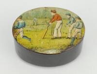 Cricket snuff box. A black lacquered papier mache oval snuff/pill box with hinged lid, believed to be circa 1870’s. The lid painted with a cricketing scene of boys playing cricket with trees in background. The box measures approx 2.75” x 2”x 1.25” deep. M