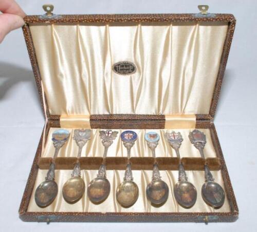 Alec Bedser. M.C.C. tour to Australia 1946/47. Set of seven silver metal (EPSN) teaspoons in presentation case by Herbert’s of Adelaide. Each spoon with decorative colour enamel ‘knop’ to handle depicting scenes of Australian cities, Canberra, Brisbane, P