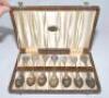 Alec Bedser. M.C.C. tour to Australia 1946/47. Set of seven silver metal (EPSN) teaspoons in presentation case by Herbert’s of Adelaide. Each spoon with decorative colour enamel ‘knop’ to handle depicting scenes of Australian cities, Canberra, Brisbane, P