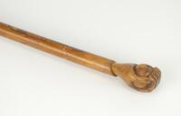 Cricket walking stick/cane. Cricket themed adult walking stick/cane circa 1890/1900 with handle shaped and carved as a hand holding a cricket ball and in addition, the shape of a cricket bat has been carved to the shaft with a brass tip to end. The stick 